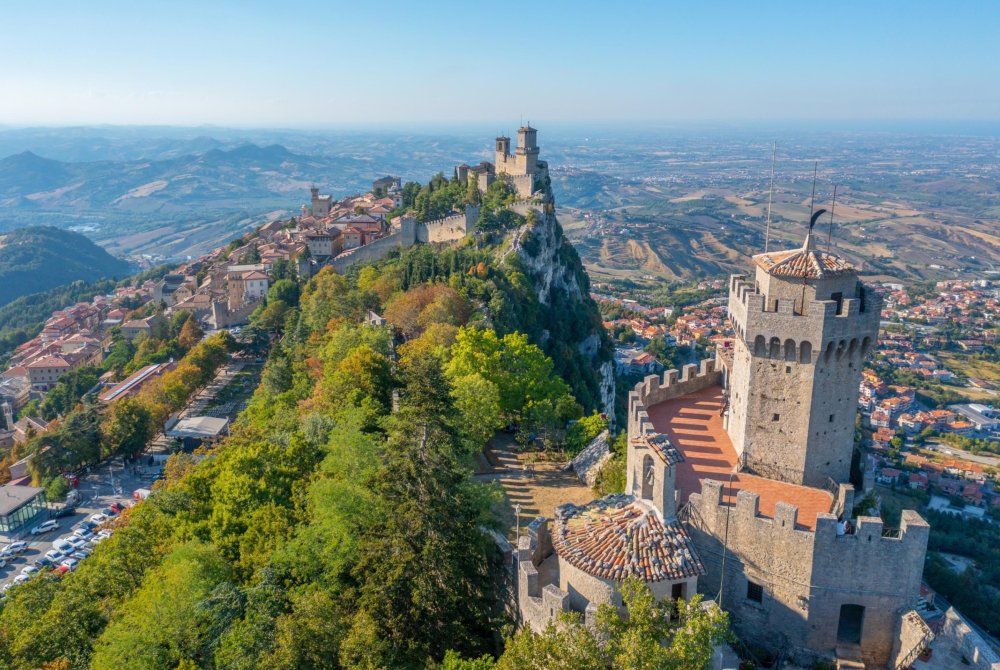 Aerial view of San Marino dominated by Torre Guaita and Torre Cesta.
