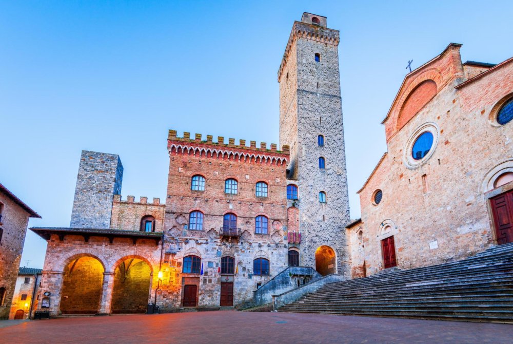 Picturesque View of famous Piazza del Duomo in San Gimignano at sunrise, Tuscany, Italy